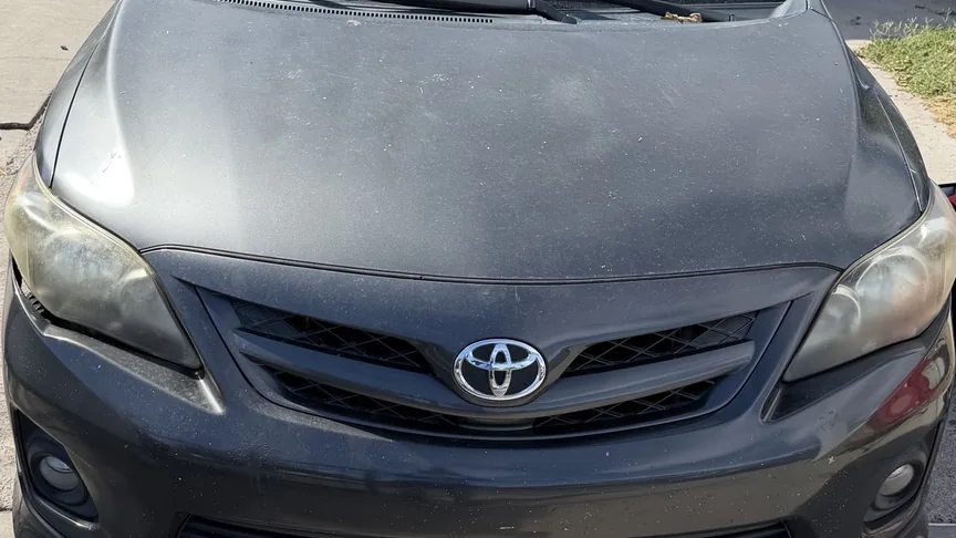 Toyota Corolla with cloudy headlights before restoration